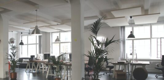 How To Optimize Office Space? An open office layout with lots of natural light and open space, an example of how to optimize office space.