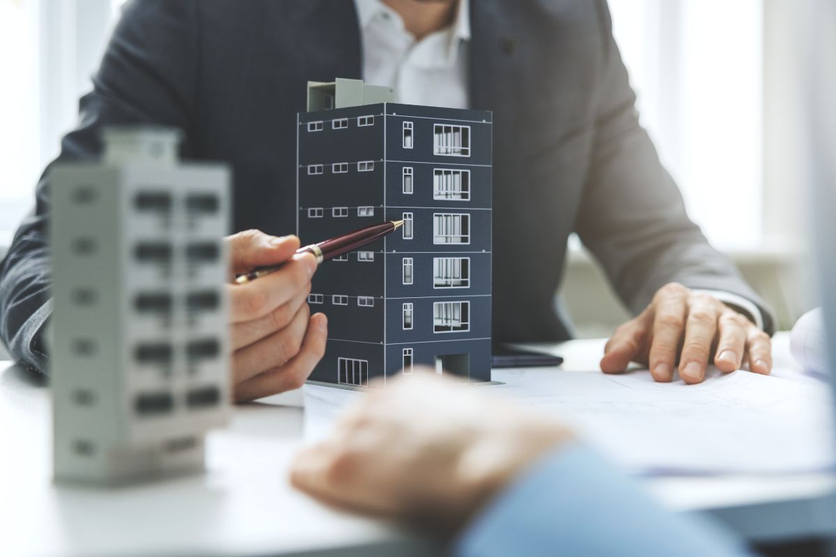 Real Estate Agent Handing Over the Keys in Front of Vacant Business Office 2