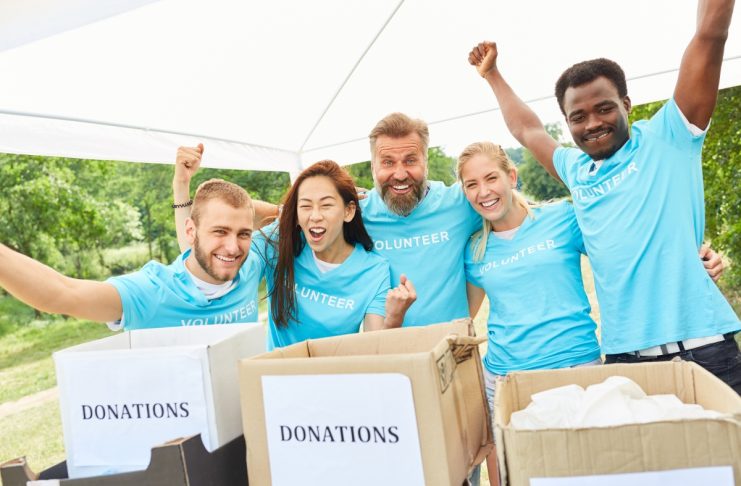 Volunteer volunteers cheer at a charitable fundraiser