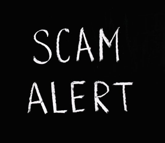 Why Small Businesses Are Prime Targets for Moving Scams and How to Stay Safe A black man showing the stop gesture with his hands